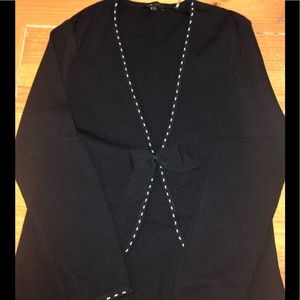 Elegant black cardigan sweater with white trim